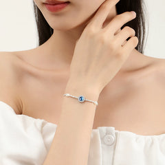 Fizzlejewels  Sterling Silver Evil Eye Bracelet with Blue CZ Stone & Pearl Beads – Protection Jewelry for Women